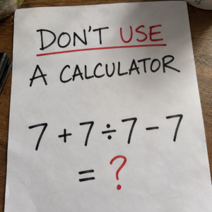 Math puzzle showing 7 plus 7 divided by 7 minus 7