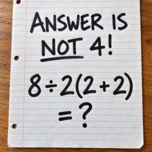 Math puzzle showing 8 ÷ 2(2 + 2)