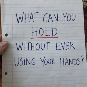 Riddle asking what you can hold without ever using your hands