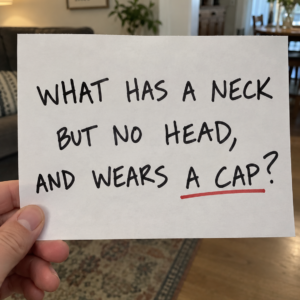 Riddle asking what has a neck but no head and wears a cap